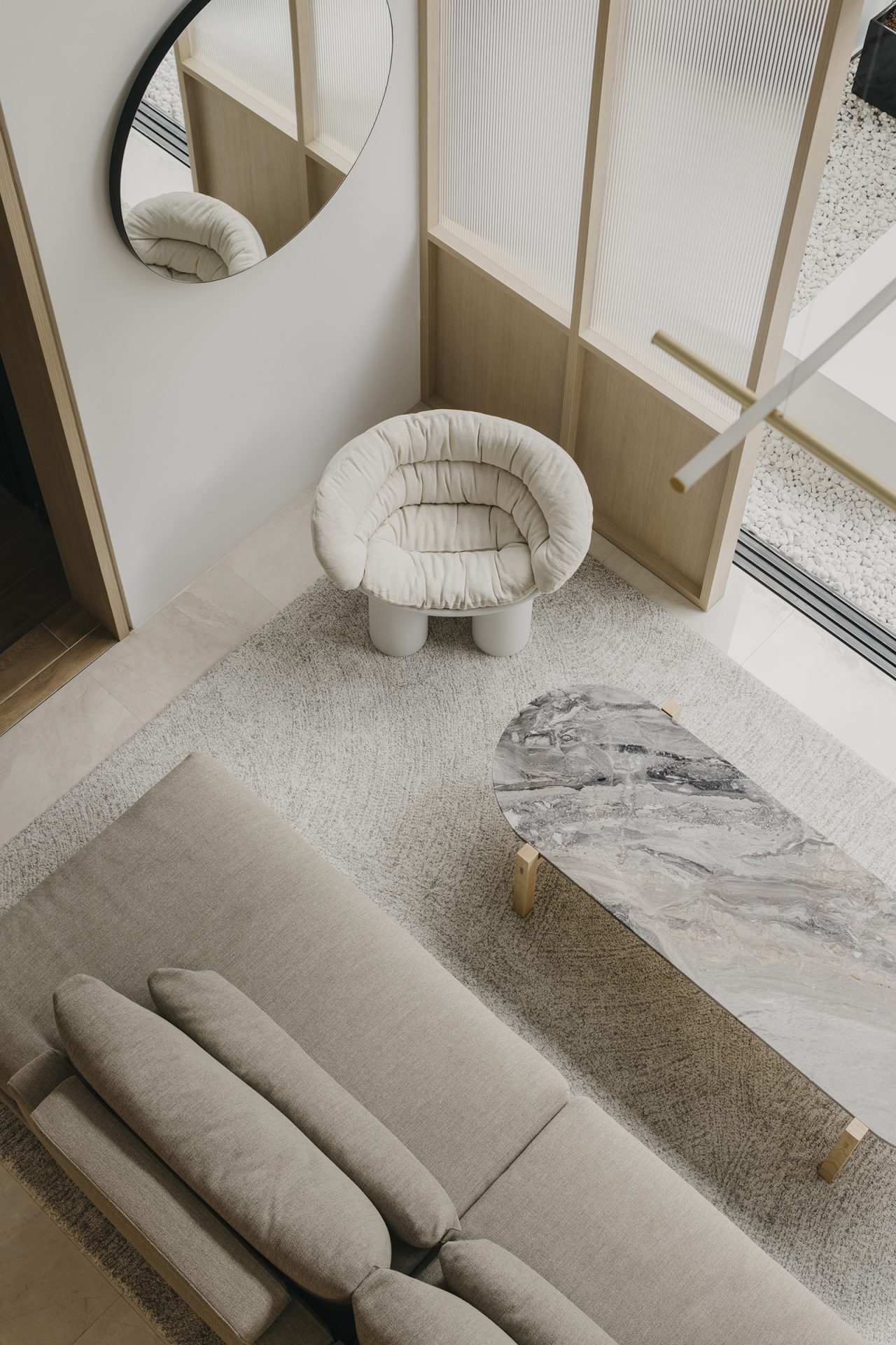 Duplex apartment in Novena by Right Angle Studio, Roly Poly armchair